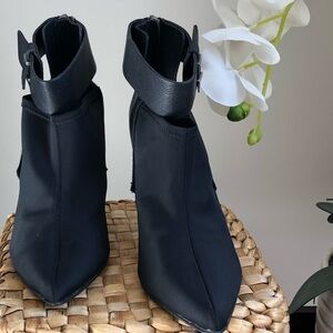 JD Joe’s black ankle booties stiletto heel pointed toe and buckle strap.